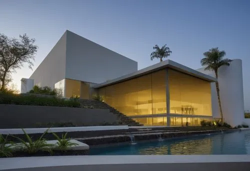 Diseño exterior de una casa moderna estilo minimalista combinando muros de color blanco con muros de tabique aparente, herrería de aluminio con cristal, fotografía hiperrealista, fotografía arquitectó