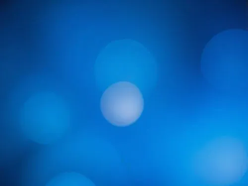 a close up of blue blurry background with circles,blue light,square bokeh,bokeh lights,bokeh pattern,bokeh,blue lamp