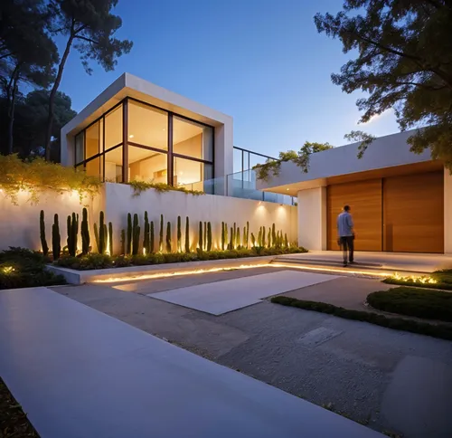 a man stands outside of a modern house,prefab,modern house,smart home,piramal,beautiful home,frame house