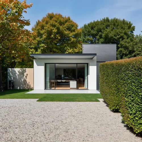 1Building,this is a modern house with a glass - walled patio,dinesen,boxwood,modern house,landscaped,eichler,tugendhat,vicarage,annexe,rietveld,buxus,passivhaus,lohaus,gaggenau,showhouse,boxwoods,dune