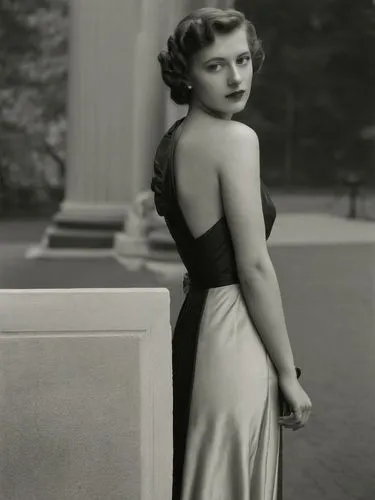 A lady from the 1940s in front of a classical column.,a young woman in a dress poses for a picture,ingrid bergman,feldshuh,maureen o'hara - female,jane russell-female,lansbury,hayworth,Photography,Bla