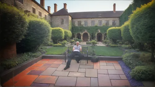 a very large courtyard gardens surround in a mansion,courtyard,album cover,in the garden,roof garden,the garden,alfresco,artificial grass,english garden,digital compositing,man on a bench,monastery ga