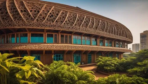 Modern Ghanaian architectural building design, Afro-futurism style, vibrant colors, geometric patterns, intricate carvings, wooden accents, corrugated iron roofing, large windows, open spaces, natural