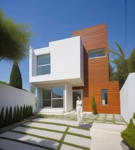 Diseño exterior de una casa moderna estilo minimalista combinando muros de color blanco con muros de tabique aparente, herrería de aluminio con cristal, fotografía hiperrealista, fotografía arquitectó