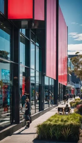 Christchurch, New Zealand, film festival venue, modern architecture, sleek lines, glass facade, steel beams, minimalist interior, projector screen, red carpet, film posters, spotlights, wooden seating