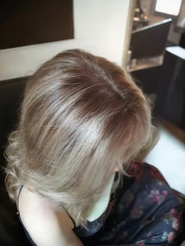 she is sitting alone in a beautiful hair salon,chignon,hair coloring,natural color,blond hair,layered hair,ringlet,hair,pin hair,short blond hair,brown,hairdressing,smooth hair,hairdressers,blonde,bac