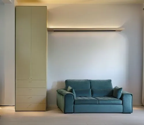 a large shelf above the sofa lights up with its large LED in a modern and warm style, the welcoming and soft sofa matches the rest of the house perfectly and the wardrobe next to it has a very well-ma