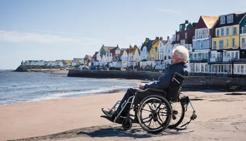 Write a heartwarming story about overcoming a handicap in a small seaside town.,floating wheelchair,wheelchair sports,motorized wheelchair,wheelchair,girl with a wheel,care for the elderly,disabled sp