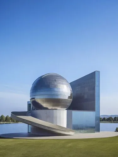 A building used as an observatory and astronomy in the center of a park,large stainless sphere in front of the facade of a modern building,futuristic art museum,fermilab,planetariums,niemeyer,snohetta