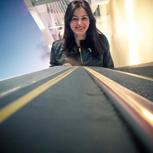 low angle photography,moving walkway,social,overpass,metro escalator,the girl at the station,skytrain,jet bridge,escalator,yellow line,ramp,skyway,hollywood metro station,highline,dulles,tarmac,rail w