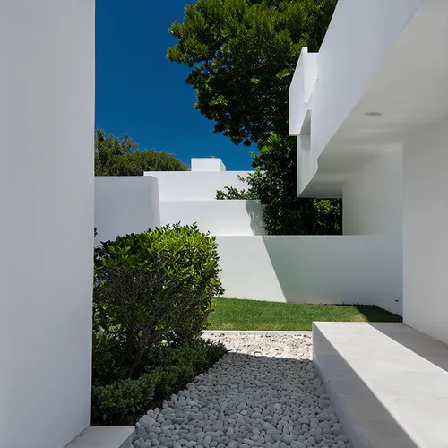 1building, minimalist architecture, simple lines, unadorned surfaces, form and function, no decoration, harmonious materials, neutral color palette, serene ambiance, integrated with environment, natur