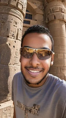 Egyptian teenage boy smiling at a camera standing in front of castle,abu simbel,edfu,egypt,aswan,ramses ii,egyptian temple,ancient egypt,karnak,egyptology,ancient egyptian,egyptians,egyptian,3d albhab