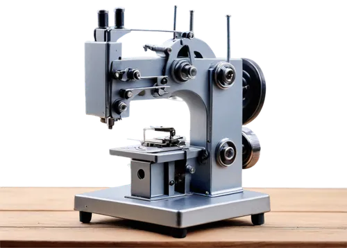 Tailoring machine, industrial equipment, metal body, silver color, buttons and screens, threads and needles, rolling wheels, pedals on floor, wooden worktable nearby, soft lighting, shallow depth of f