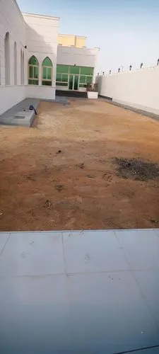 the view from behind a closed window of an old house,king abdullah i mosque,al nahyan grand mosque,al-askari mosque,uhud,nizwa,sheihk zayed mosque,qasr al watan,garowe,qasr al kharrana,abu dhabi mosqu