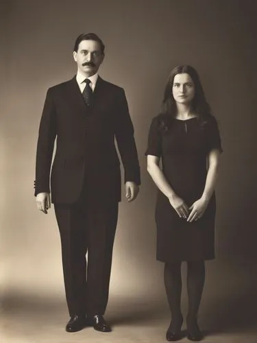 Official black and white photo double portrait of Their Majesties King Charles I and Queen Olga of Württemberg.,a man standing next to a woman with the other side facing away,man and wife,casados,adda