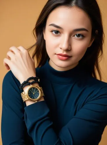 a woman standing in front of a tan wall holding her hands behind her back,gold watch,panerai,rolex,celebutante,casio,bulova