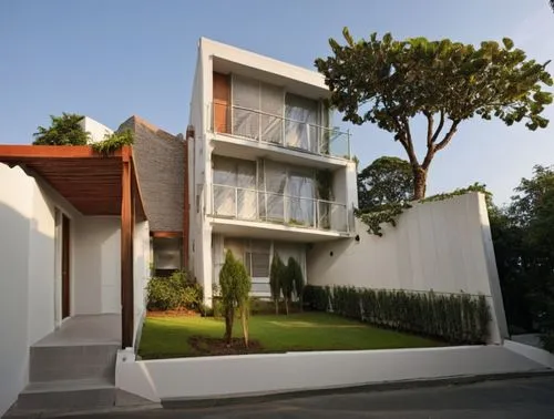 DISEÑA EL EXTERIOR DE UN EDIFICIO DE DAPARTAMENTOS ESTILO  MINIMALISTA, CON ACABADOS EN MURO DE COLOR BLANCO  Y CON MUROS EN TABIQUE APARENTE, CANCELES DE ALUMINIO CON CRISTAL, AMBIENTACIÓN CON PERSON