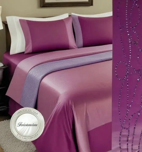 a purple comforter with decorative embroidered trim and pillows,bed linen,purple cardstock,pillowtex,upholstering,bedspreads,purple