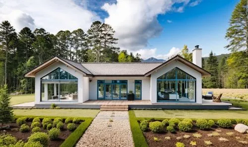 Modern house in American style. There is a mixed forest around. There is a lawn in front of the house.,a home with many trees and shrubs in the background,forest house,landscaped,grass roof,beautiful 