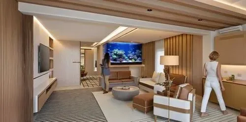 fish tank with coral reef and many fishes,two people are looking at a large tv screen,luxury bathroom,luxury suite,modern room,interior decoration,guestrooms,luxury hotel