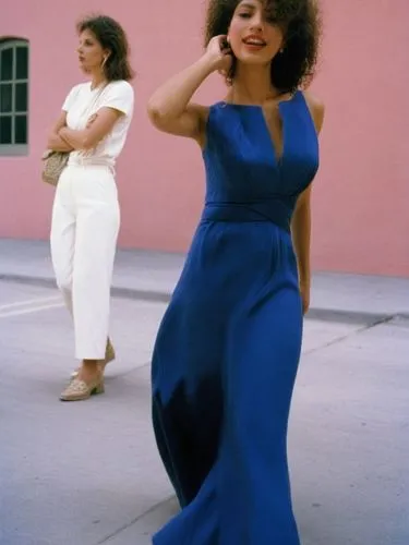 Two different women.,a woman is posing in front of a pink building,chicanas,salvadorans,salvadorians,troi,coffy,retro women,Photography,Black and white photography,Black and White Photography 06