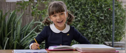 Audrey is feeling excited as she prepares for her first day of school.,girl studying,school administration software,school starts,little girl reading,child crying,the girl's face,child with a book,bul