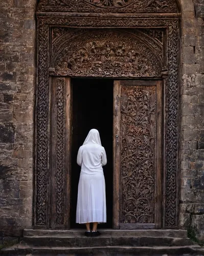 woman praying,praying woman,girl praying,middle eastern monk,carmelite order,doorway,church door,the abbot of olib,eucharistic,carthusian,eucharist,wooden door,spanish missions in california,open door,the prophet mary,empty tomb,old door,holy places,the door,the annunciation,Photography,Documentary Photography,Documentary Photography 22