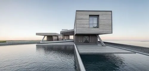 marble
,dunes house,infinity swimming pool,house by the water,modern architecture,archidaily,cubic house,pool house,cube stilt houses,modern house,knokke,aqua studio,roof top pool,floating huts,danish