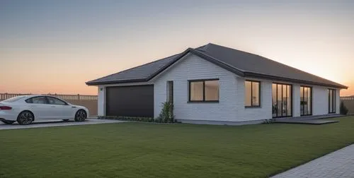 white brick home outside modern home matte black and white with plants,electrohome,folding roof,inverted cottage,smart home,homebuilding,weatherboard,golf lawn,carports,weatherboards,garages,unroofed,