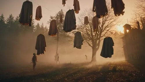 woman hanging clothes,halloween ghosts,clothesline,washing line,photos on clothes line,halloween bare trees,pictures on clothes line,witches' hats,flying seeds,clothes line,scarecrows,halloween silhouettes,human halloween,witches,vintage halloween,purgatory,celebration of witches,witch house,halloween scene,wind chimes,Photography,General,Cinematic