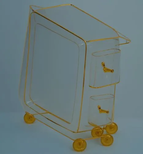 a golden glass cart has two yellow wheels on it,cart transparent,prusa,straw cart,nanolithography,stereolithography,luggage cart,kartell,computer case,gepaecktrolley,dolly cart,cube surface,vending ca