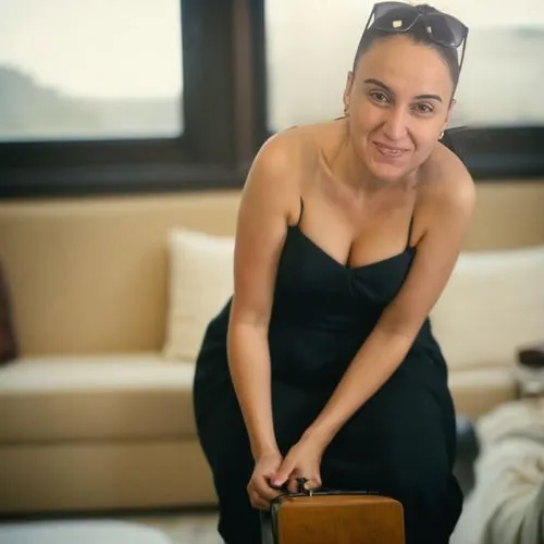 birce akalay,sitting on a chair,sofa,on a yacht,andrea vitello,travel woman,on the couch,silphie,rockabella,a girl with a camera,lena,leather suitcase,simone simon,woman sitting,social,catarina,maria,tamra,paloma perdiz,paloma