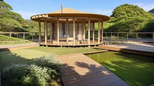 สวนเเบบญี่ปุ่น ทางน้ำด้านหน้า ด้านหลังเป็นป่าทึบ,a pavilion sits on grass with a pond in the foreground,landscape design sydney,landscape designers sydney,garden design sydney,wooden decking,summer ho