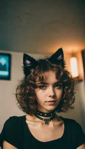 (analog photo:1.1), (a punk catgirl:1.15), (cat ears:1.1), brown short curly hair, (black t-shirt:1.15), (20 years old, young:1.2), petite, (pubic hair:1.1), choker, cream eyeliner, european, cozy bed