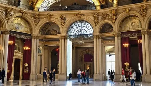 Grand museum, Parisian Beaux-Arts style, ornate stone facade, intricately carved arches, grand staircase, high ceilings, marble floors, Renaissance-inspired details, glass roof, natural light pouring 