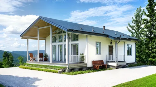 a large white house sitting on top of a grass covered hillside,glickenhaus,passivhaus,holiday villa,chalet,lohaus,summer house