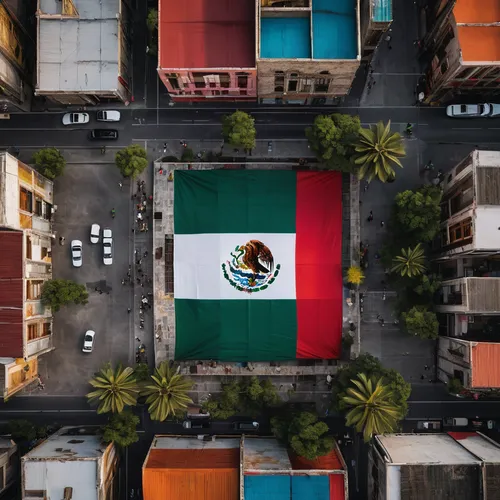 Embark on a visual exploration of Mexico, focusing on the iconic national flag. Capture dynamic shots of the Mexican flag proudly displayed against diverse backdrops – whether it's fluttering in the w