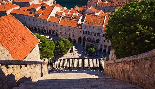 Historic Croatian architecture, Dubrovnik old town, medieval stone walls, red-tiled roofs, Gothic Renaissance style, grandiose arches, ornate facades, intricate stone carvings, narrow cobblestone stre