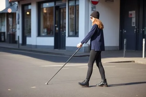 一个女人单手拿着拐杖的场景不用大改，让图片更有质感清晰
,woman walking in the street pulling a cane,woman walking,girl walking away,walking stick,scootering,to walk,stilt,Photography,General,Realistic