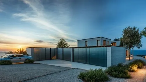 An indoor atrium with metal louvres and plants.,dunes house,landscape design sydney,modern house,landscape designers sydney,cubic house,modern architecture,holiday villa,cube house,house by the water,