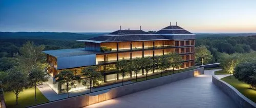 this modern building has a sloping roof in the evening,wildbad,amanresorts,leterme,therme,chancellery,sigulda,blavatnik,certegy,lindbaek,nemacolin,casa fuster hotel,luxury hotel,natolin,embl,bulgari,l