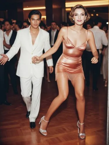 Grand beauty on the dance floor. Her lover behind.,a person in a dress and man in suit walking,salsoul,karylle,charanga,milonga,lambada,bailar,Photography,Documentary Photography,Documentary Photograp