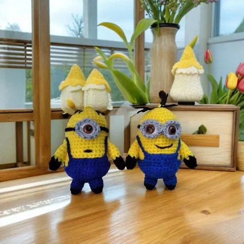 two knitted yellow and blue figures next to each other,dancing dave minion,epinions,minions,minion,bananarama,minifigures,Small Objects,Outdoor,Tulips