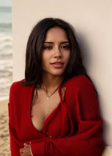 a portrait half body of a beautiful latina 24 years old black hair wearing a red top and transparent white wool sweater stand up in the beach as background in 4k,beach background,latina,kamini kusum,r