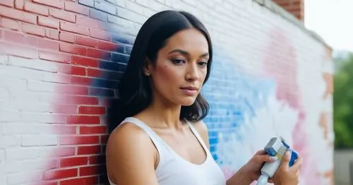 girl making selfie,graffiti,asian woman,woman holding gun,girl walking away,woman holding a smartphone