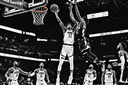 Create a hype-filled wallpaper of Ja Morant dunking in a crowded stadium.,dunker,nets,air block,cauderon,dame’s rocket,blocked shot,slam dunk,hops,riley two-point-six,backboard,riley one-point-five,ki