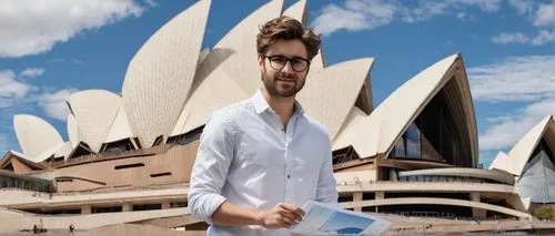 Bachelor of Design in Architecture, USYD, Atar, male, 20s, casual wear, jeans, white shirt, sneakers, messy brown hair, glasses, confident posture, holding a portfolio, standing in front of a modern u