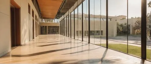 Aub University, campus building, modern architecture, glass facade, steel structure, angular lines, minimalist interior, wooden accents, floor-to-ceiling windows, natural light pouring in, empty corri