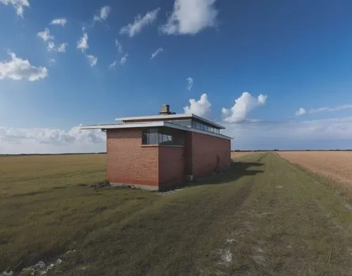 there is a red brick building on the field,lifeguard tower,westerhever,rubjerg knude lighthouse,holthouse,photogrammetric,guardhouse,hallig,dungeness,360 ° panorama,orfordness,falsterbo,photogrammetry