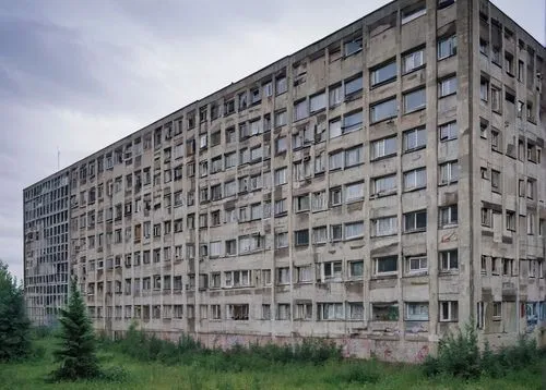 East Berlin architecture, Soviet-era buildings, brutalist style, concrete blocks, rectangular shapes, plain façades, communist-inspired murals, graffiti-covered walls, neglected but charming, urban la